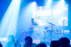 Bryan Lewis DJing on stage at an after party coordinated by Khoreen Eccleston for GreenBiz Group VERGE 23